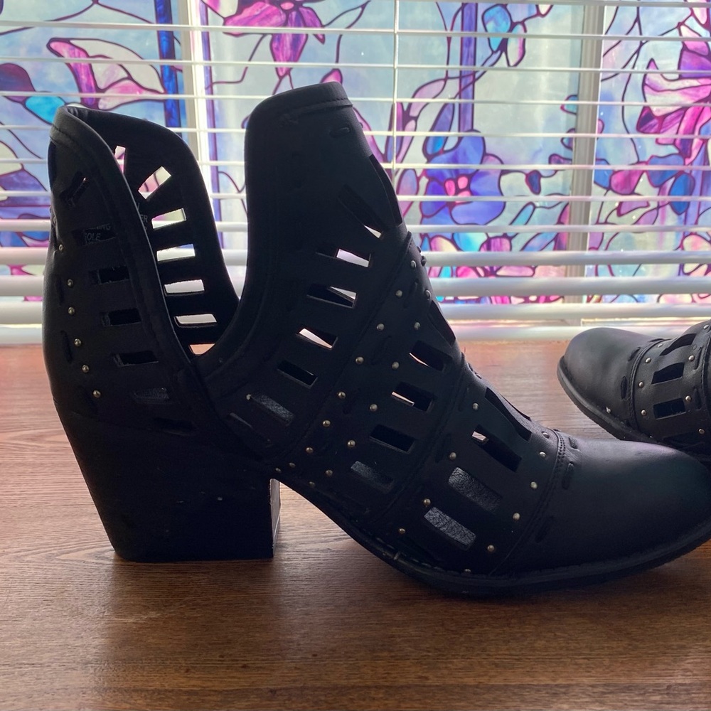 Black leather booties with silver accent and cut out design - like new !